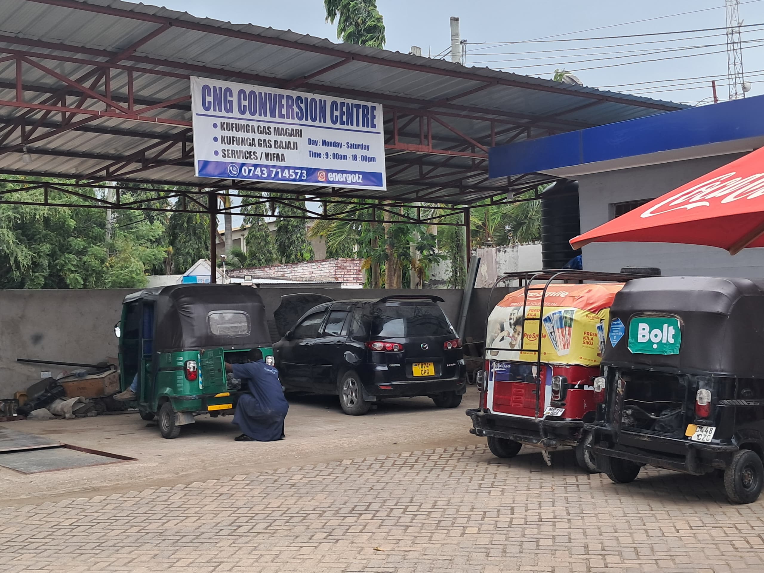 Energo CNG Conversion Centre with cars and bajaji being converted